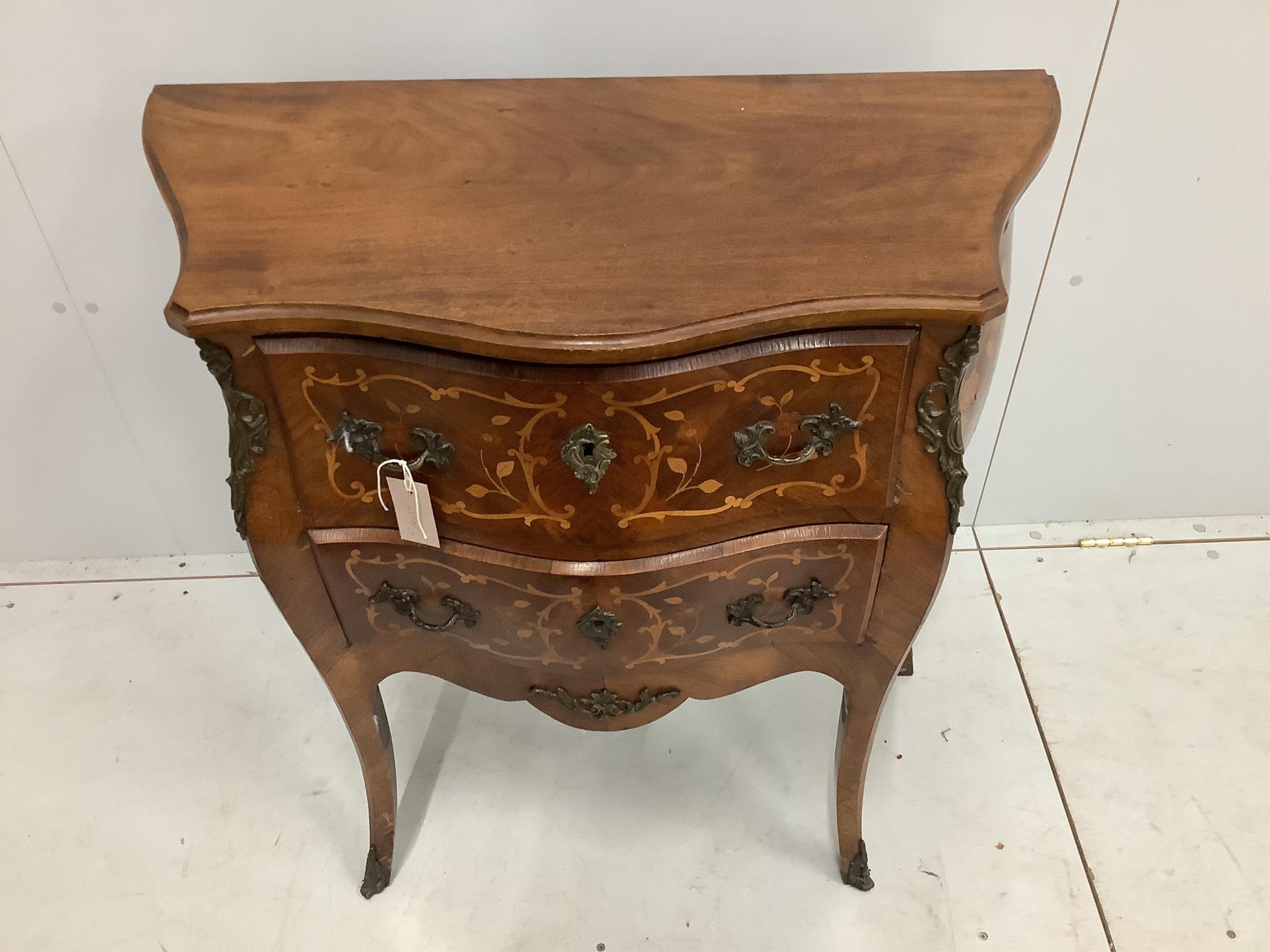 A small Louis XVI style marquetry inlaid two drawer bombe commode, width 79cm, depth 37cm, height 85cm. Condition - fair